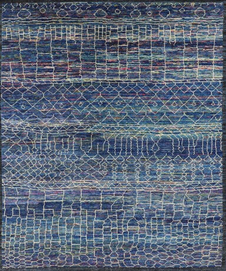 An indigo handmade Moroccan rug with a fine white lattice, by Olker Rugs